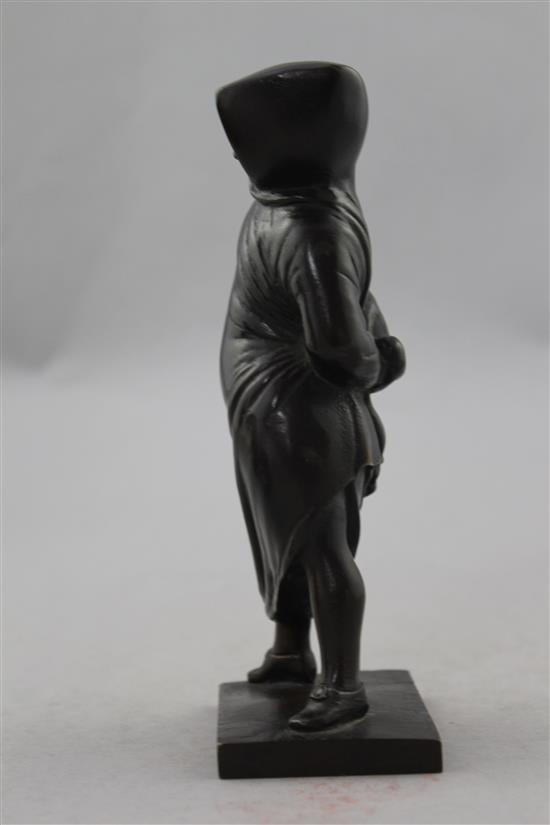 Small Italian patinated bronze of a figure standing in a hooded cloak,(-)